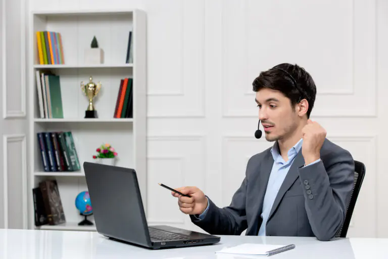 customer-service-cute-guy-grey-suit-with-computer-headset-holding-fists-up (1)